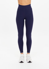 THE UPSIDE women's navy recycled peached Maison 25inch Midi Pant is mid-rise and features cream scalloped edge trim at hem. Made for yoga & pilates.