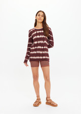 THE UPSIDE women's brown & cream tie dye organic cotton Amana Long Sleeve Knit is designed for a relaxed fit and features a contrast striped neckline in orange. Made for everyday.
