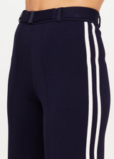 THE UPSIDE women's navy Monte Carlo Freya Knit Pant fits true-to-size and features an elasticated waistband with belt and knitted white side stripes. Made for lifestyle.