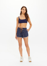 THE UPSIDE women's navy & white stripe Belize Marlin Short is a low-rise mini short, featuring a elasticated waistband with drawcord, side seam pockets in linen fabrication. Made for lifestyle.