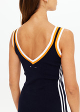 THE UPSIDE women's white organic cotton tennis Riley Knit Dress is designed for a slim fit and features wide straps and a V neckline with white stripes down the side.