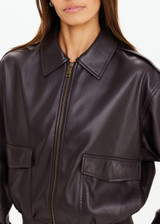 THE UPSIDE women's brown Zariah Bomber Jacket, made from soft vegan leather fabrication, is a regular fit and features a zip-through front and patch pockets. Made for lifestyle.