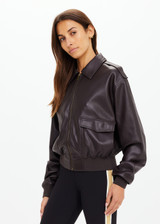 THE UPSIDE women's brown Zariah Bomber Jacket, made from soft vegan leather fabrication, is a regular fit and features a zip-through front and patch pockets. Made for lifestyle.