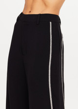 THE UPSIDE women's black Haveli Wide Leg Pant is true to size with a structured waistband, fly zipper, belt loops, and cream embroidered side seams. Made for lifestyle.