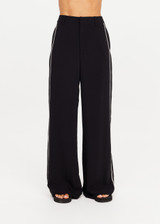 THE UPSIDE women's black Haveli Wide Leg Pant is true to size with a structured waistband, fly zipper, belt loops, and cream embroidered side seams. Made for lifestyle.