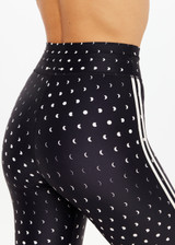 THE UPSIDE women's black Moonstone 25inch Legging has a soft, supportive fit with elastic drawcord, cream aglet ends, and contrast cream side bindings. Made for yoga & pilates.