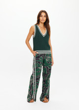 THE UPSIDE women's green Santa Fe Julia V Neck Vest is relaxed fit with chunky cable knit, deep V-neckline, and cream-green striped ribbing. Made for lifestyle.
