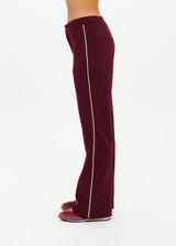 THE UPSIDE women's maroon Mendoza Jackie Flare Pant is true to size and features cream piping along side seams and zipper pockets. Made for lifestyle.