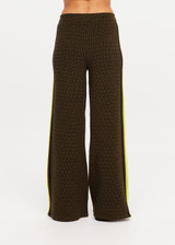 THE UPSIDE women's olive organic cotton Castilla Juniper Knit Pant has a soft and supportive fit and features a straight leg with contrast side stripes. Made for lifestyle.