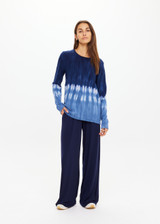 THE UPSIDE women's tie dye organic cotton Seeker Amana Long Sleeve Knit is designed for a regular fit and features a ribbed neckline. Made for lifestyle.