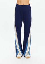 THE UPSIDE women's navy Lenzing viscose Petra Flare is designed for a true-to-size fit and features flare pants with splits and contrast chevron tape down side seams. Made for lifestyle.