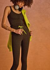 THE UPSIDE women's olive jacquard Castilla 25 Inch Midi Pant is designed for a soft and comfortable fit and features mid-rise with lime elastic drawcord. Made for yoga and pilates.