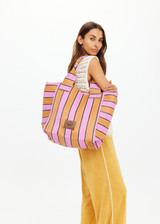 THE UPSIDE women's stripe Puerto Market Tote Bag features a zip closure and an internal pocket. Perfect for travelling and vacation.