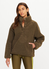 THE UPSIDE women's green recycled polyester Harlow Fleece Pullover is designed for a relaxed fit and features a quarter snap button opening and zip pockets. Made for lifestyle.