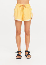 THE UPSIDE women's yellow Klio Short is designed for a mid-rise, relaxed fit and features a soft elasticated waistband with drawcord and contrast binds in cream along curved hem. Made for everyday.