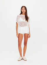 THE UPSIDE women's white Memento Lace Sammi Tee is designed to be sheer, oversized and can be paired with the Capri Bra for coverage. Made for lifestyle.