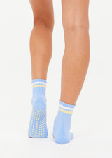 THE UPSIDE women's blue anti-slip Rever Grip Sock features stripes in cream and lemon and a soft terry sole with lemon star grippers. Made for yoga & pilates.