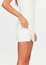 THE UPSIDE women's cream Lyon Pia Racerback Dress is a fitted stretch lace tennis dress with a high neck, A-line skirt and internal bodysuit with inner shorts and pockets. Made for tennis, golf & pickleball.