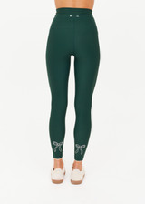 THE UPSIDE women's green recycled soft peached Racquet 25inch Pocket Legging is mid-rise and features side pockets, an elasticated drawcord and mini scallop lce detailing at cuffs. Made for tennis, golf & pickleball.