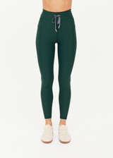 THE UPSIDE women's green recycled soft peached Racquet 25inch Pocket Legging is mid-rise and features side pockets, an elasticated drawcord and mini scallop lce detailing at cuffs. Made for tennis, golf & pickleball.