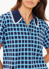 THE UPSIDE women's navy and blue plaid cotton Clubhouse Dom Polo Shirt is a relaxed fit and features a knitted collar with cream crochet detailing on edge. Made for tennis, golf & pickleball.