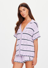 THE UPSIDE women's lilac organic cotton Amara Amayah Knit Shirt is a relaxed fit and features an open knit heart design and pearlised shell buttons. Made for tennis, golf & pickleball.