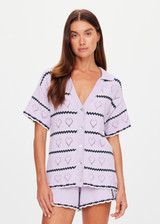 THE UPSIDE women's lilac organic cotton Amara Amayah Knit Shirt is a relaxed fit and features an open knit heart design and pearlised shell buttons. Made for tennis, golf & pickleball.