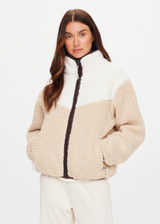 THE UPSIDE women's natural Harlow Fleece Zip Through is designed for a relaxed fit in a warm fleece fabrication and features an elastic waist and cuffs and zip pockets. Made for lifestyle.