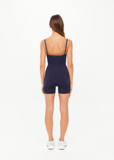 THE UPSIDE women's navy Form Seamless Jamie Bodysuit is firm and suportive and features a scooped neckline with a double layer bra with contrast tan underlayer. Made for pilates and yoga.