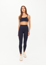 THE UPSIDE women's navy Form Seamless Kelsey Bra is firm and supportive and features a double layer with contrast tan underlayer and soft ribbed underbust. Made for yoga & pilates.