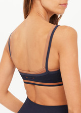 THE UPSIDE women's navy Form Seamless Kelsey Bra is firm and supportive and features a double layer with contrast tan underlayer and soft ribbed underbust. Made for yoga & pilates.