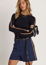 THE UPSIDE women's navy Toledo Leon Bermuda Short is a longerline tailored short featuring tan knitted tape down sides, flat waistband with belt loops and side pockets. Made for lifestyle.