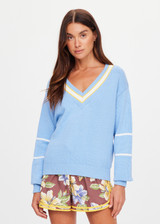THE UPSIDE women's blue organic cotton Rever Josette V Neck Sweater is designed for a relaxed fit and features a striped V neckline in yellow and blue and contrast starts on sleeves. Made for everyday.