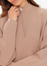 THE UPSIDE women's mocha Veneto Carter Knit Zip Top fits true-to-size and features a half zip and arrow logo on sleeve hem. Made for lifestyle.