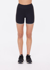 THE UPSIDE women's black recycled rib Rhythm 5inch Spin Short is mid-rise and features cream and mocha binds along side seams. Made for yoga & pilates.