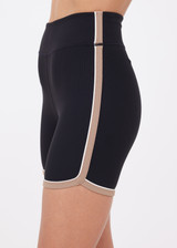 THE UPSIDE women's black recycled rib Rhythm 5inch Spin Short is mid-rise and features cream and mocha binds along side seams. Made for yoga & pilates.