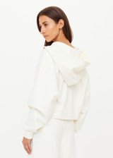 THE UPSIDE women's cream organic cotton terry Arkana Priah Hoodie is designed for a relaxed fit with dropped shoulders and features a lace up front. Made for lifestyle.