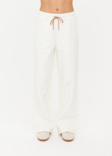 THE UPSIDE women's cream organic cotton terry Arkana Estelle Pant is designed for a relaxed fit with a barrel shaped leg and features an elasticated waistband and side pockets. Made for lifestyle.