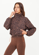 THE UPSIDE women's leopard recycled Ludlow Ace Shell Jacket offers a water resistant, cropped design with front pocket, elasticated cuffs and an orange drawcord at waist. Made for running.