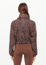 THE UPSIDE women's leopard recycled Ludlow Ace Shell Jacket offers a water resistant, cropped design with front pocket, elasticated cuffs and an orange drawcord at waist. Made for running.