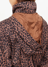 THE UPSIDE women's leopard recycled Ludlow Ace Shell Jacket offers a water resistant, cropped design with front pocket, elasticated cuffs and an orange drawcord at waist. Made for running.