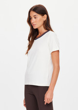 THE UPSIDE women's cream organic cotton Zahra Rib Tee features a rib fabrication and striped neckline in navy and tan. Made for lifestyle.