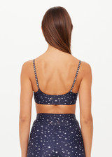 THE UPSIDE women's blue Bellaire Ballet Sports Bra features a cream star print and offers soft support and low coverage, designed with adjustable straps and a supersoft recycled fabrication. Made for yoga & pilates.