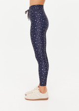 THE UPSIDE women's blue Bellaire 25Inch Legging features a cream star print with a mid rise design, tan striped drawcord and a supersoft recycled fabrication. Made for yoga & pilates.