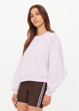 THE UPSIDE women's purple 100% organic cotton Paloma Crew features a ribbed neckline, cuff and hems in a relaxed fit. Made for lifestyle.