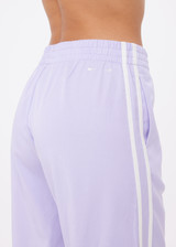 THE UPSIDE women's lilac Juliet Pant features a low-rise with side stripes, an elasticated waist, sideseam pockets and split hem detail. Made for lifestyle.