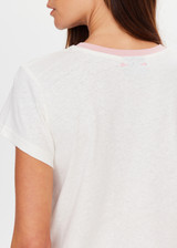 THE UPSIDE women's cream McGrath The 70's Tee is 70's inspired, crafted from a hemp and organic cotton blend and features a contrast rib neckline in pink. Made for everyday wear.