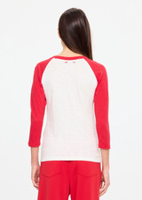 THE UPSIDE women's cream 100% organic cotton Take Me To The Ball Park Top features a soft ribbed neckline with contrast red 3/4 length sleeves. Made for lifestyle.
