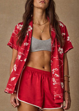 THE UPSIDE women's red 100% silk Run For Your Life Silk Short is a low-rise fit with a soft elastic waistband and cream piping along side seams. Made for lifestyle.
