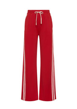 THE UPSIDE women's red When In Roma Holiday Pant is high waisted with an elasticated waistband, made from double faced single jersey fabrication with cream mesh tape along side seams. Made for lifestyle.